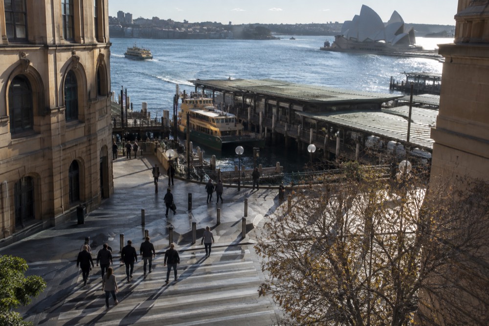 A pedestrian crossing in the Sydney city centre with heritage buildings on both sides