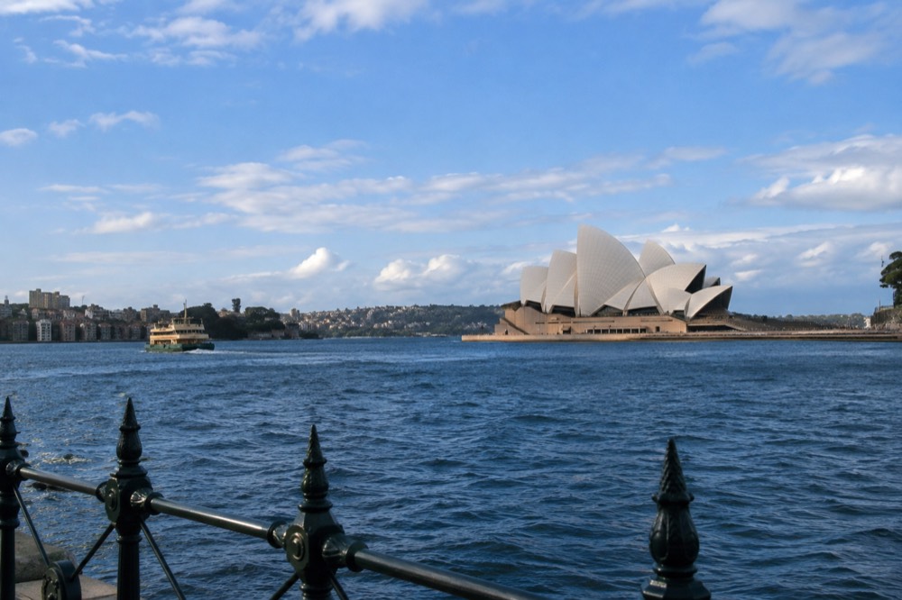 Sydney Opera House sails seen across Circular Quay on a bright morning