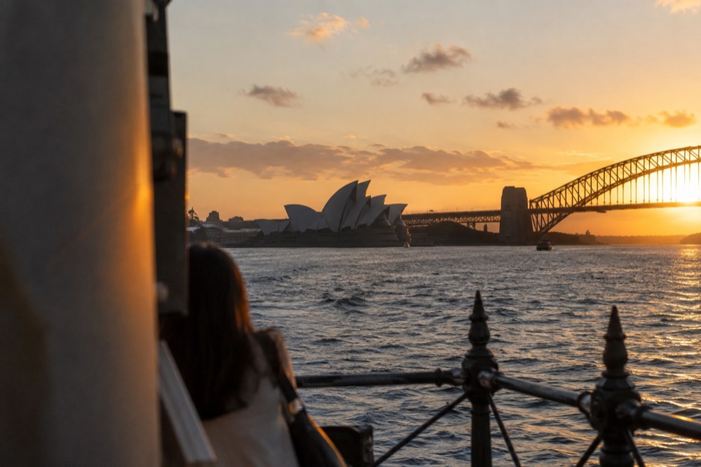 Sunset light on the Sydney Opera House with the harbour bridge in the background