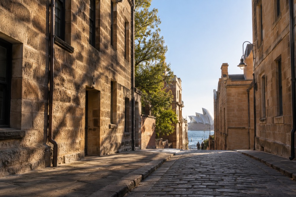 Historic sandstone buildings along a laneway in The Rocks