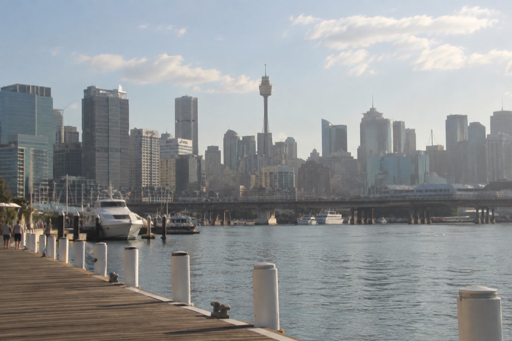 Sydney city skyline seen across Darling Harbour with the observation tower rising above the buildings