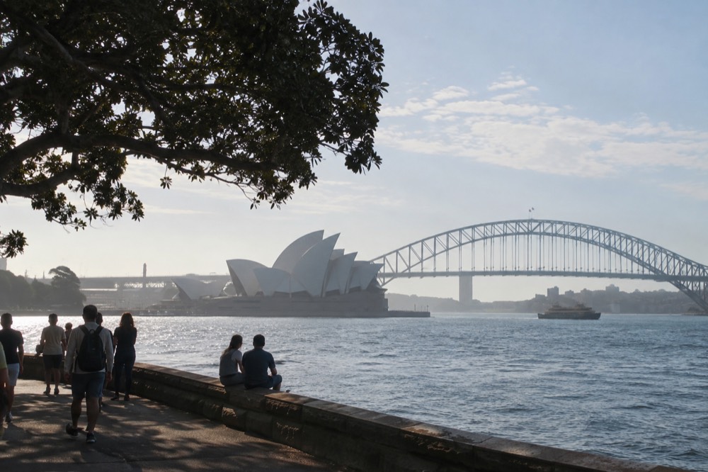 Morning light on the Sydney Opera House forecourt with the harbour bridge behind it