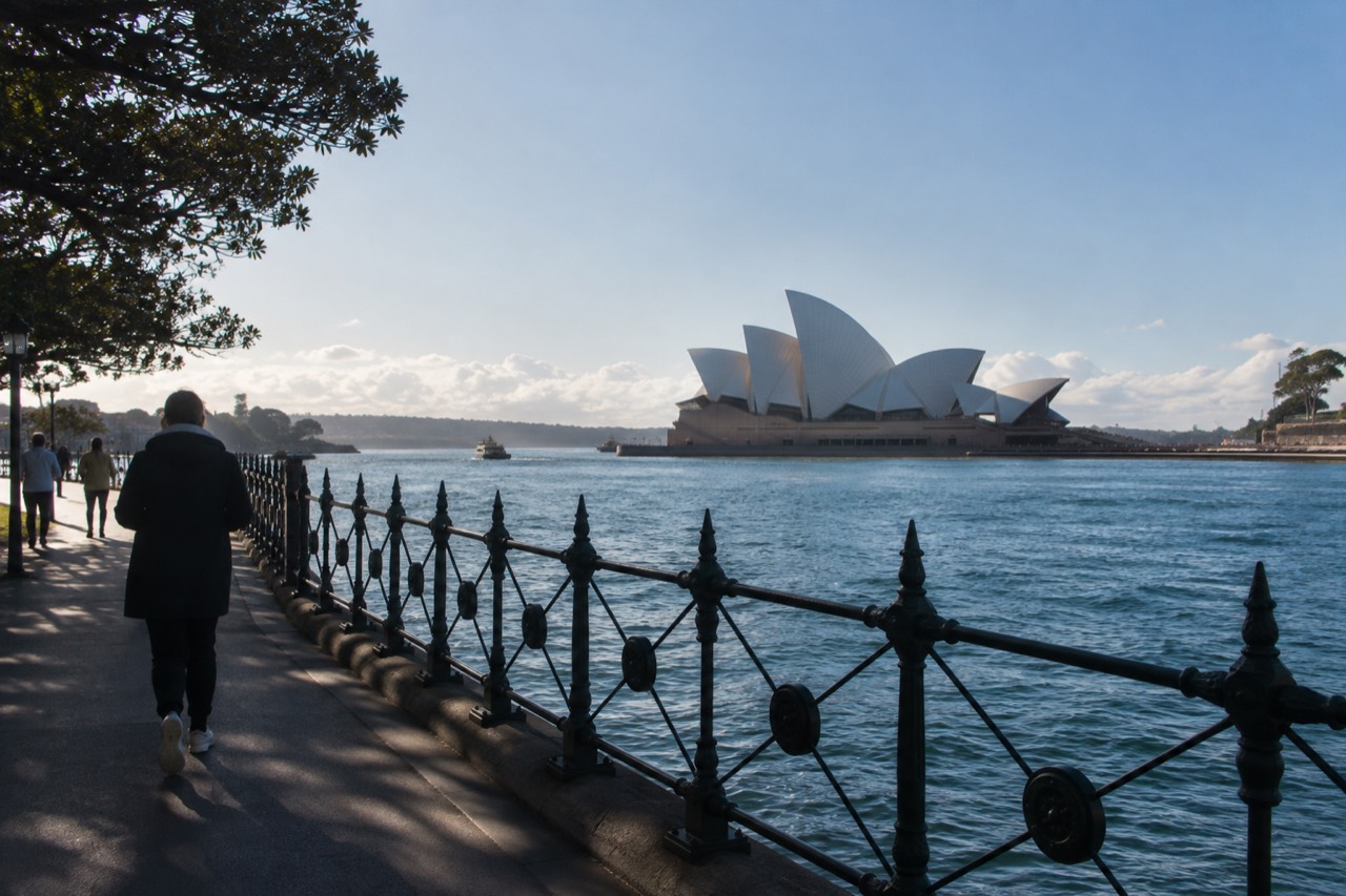 The white sail roofs of the Sydney Opera House seen from Circular Quay on a clear morning
