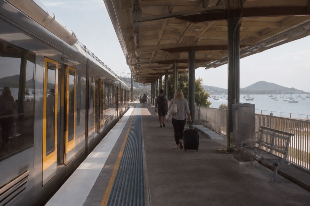 A Sydney Trains intercity service at a station platform on the way north from Central