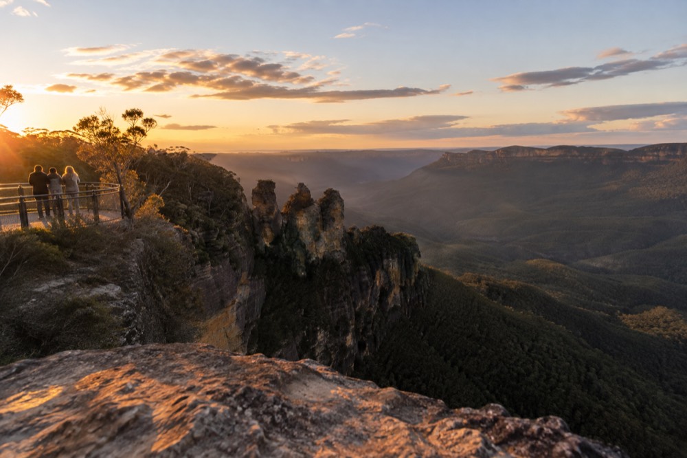 Sandstone cliffs and forested valley in the Blue Mountains seen from a lookout