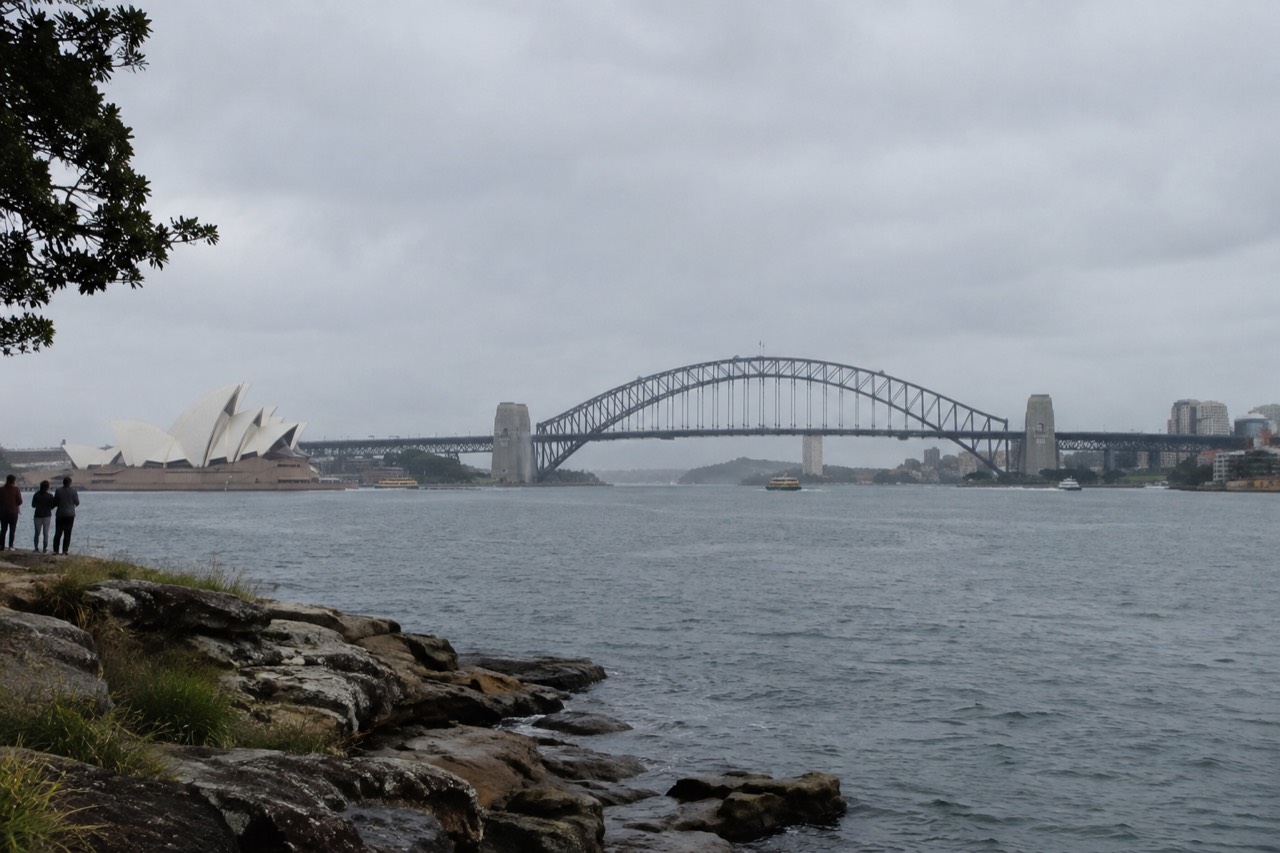 Sydney harbour foreshore with the Opera House and Harbour Bridge in morning light