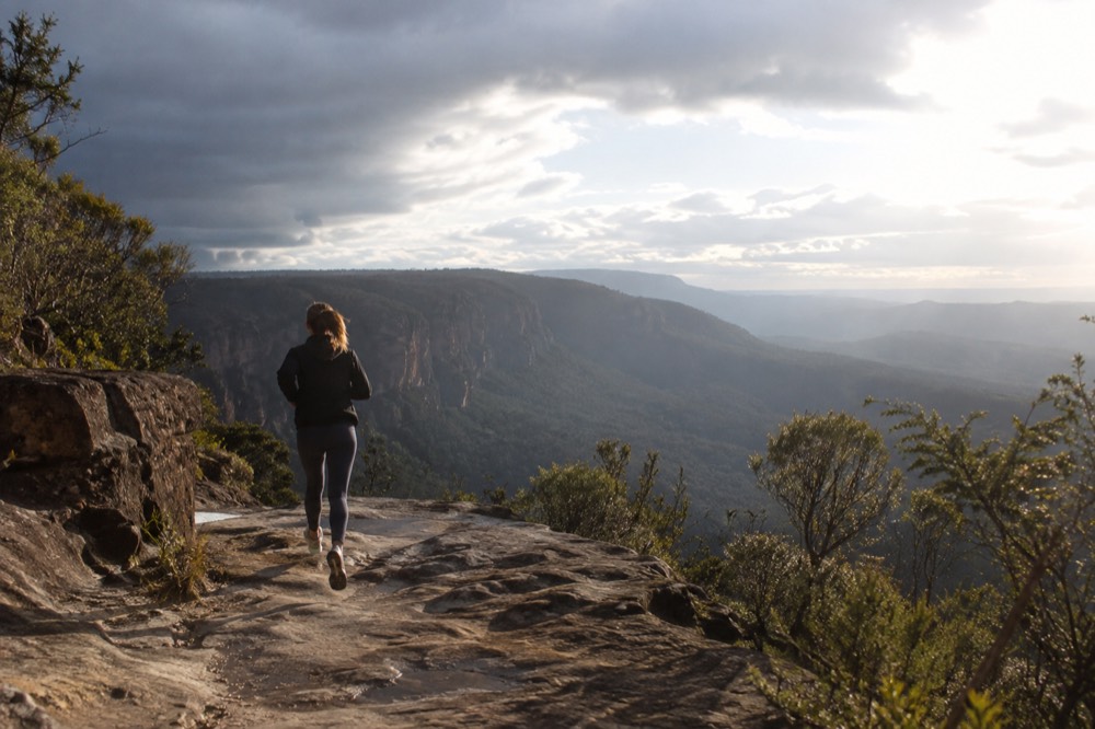 Sandstone cliffs and forested valley views from a lookout above the Blue Mountains
