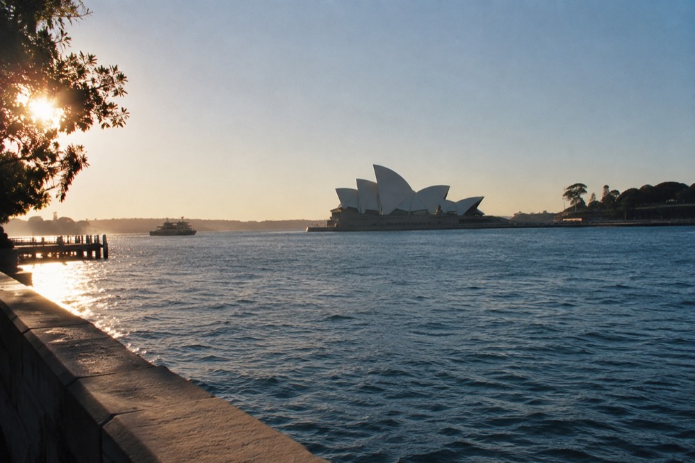 Sydney Opera House sails seen across the water on a clear late winter morning