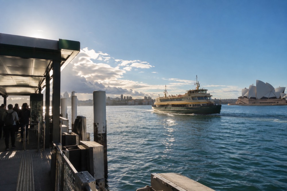 A Sydney ferry crossing the harbour toward Manly on a calm winter morning
