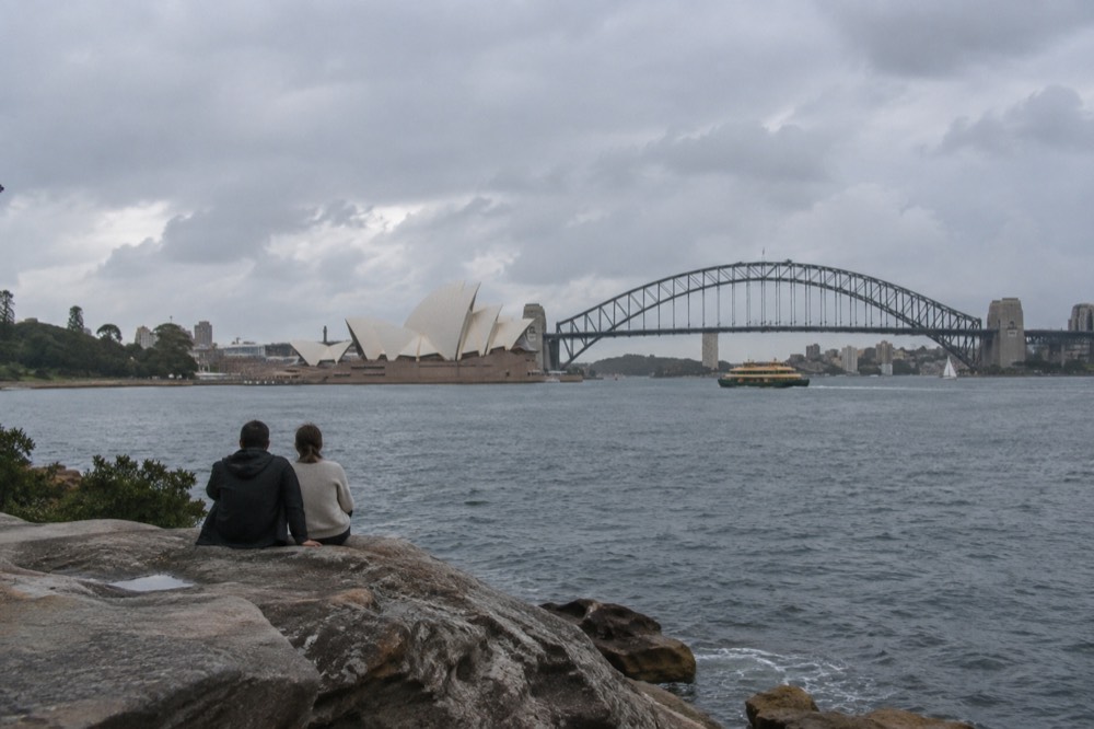 Sandstone point overlooking the harbour with the Opera House sails and Harbour Bridge in the background