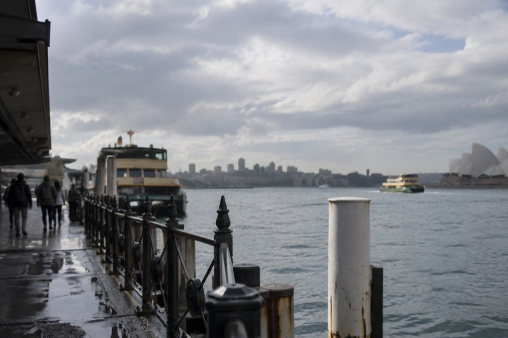 Grey rain clouds passing over Sydney Harbour on an overcast winter morning