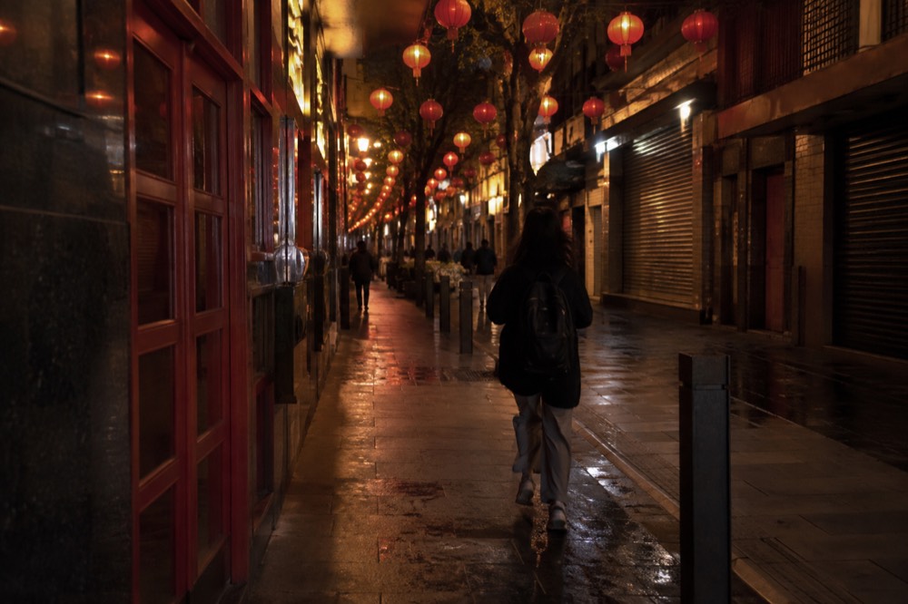 Dixon Street mall at night with red lanterns glowing above closed shopfronts