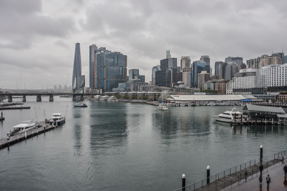 Wide view of Cockle Bay at Darling Harbour with apartment towers behind the water