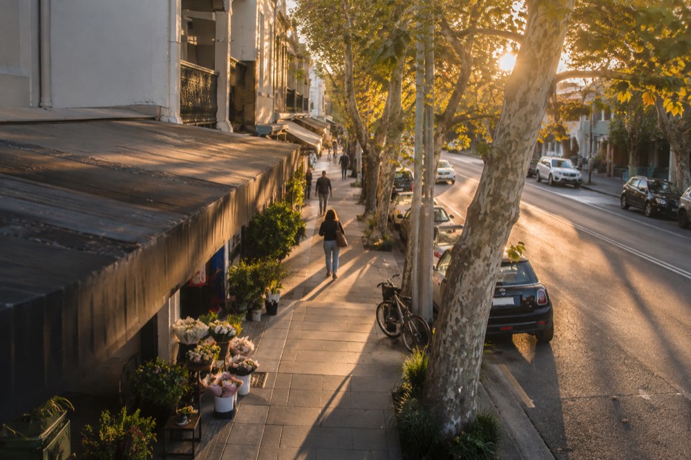 The Glebe Point Road streetscape with awnings, small shops and plane trees