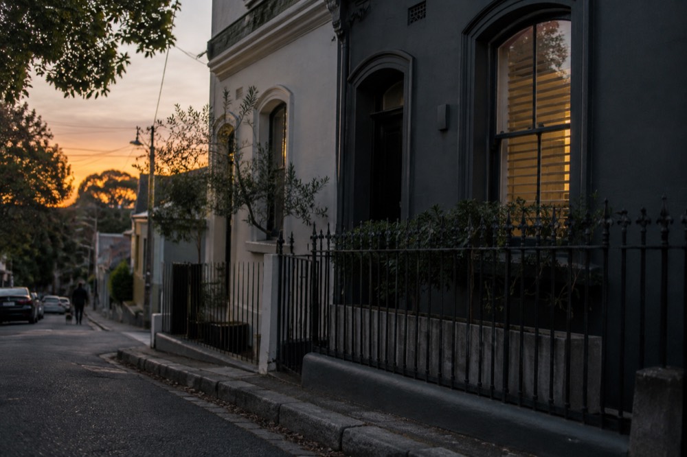 Two terrace facades with contrasting painted colours on a narrow Paddington lane