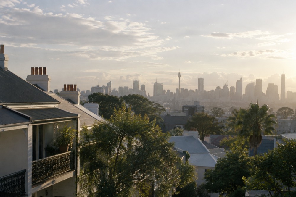 View across Paddington rooftops toward the city skyline in late afternoon light
