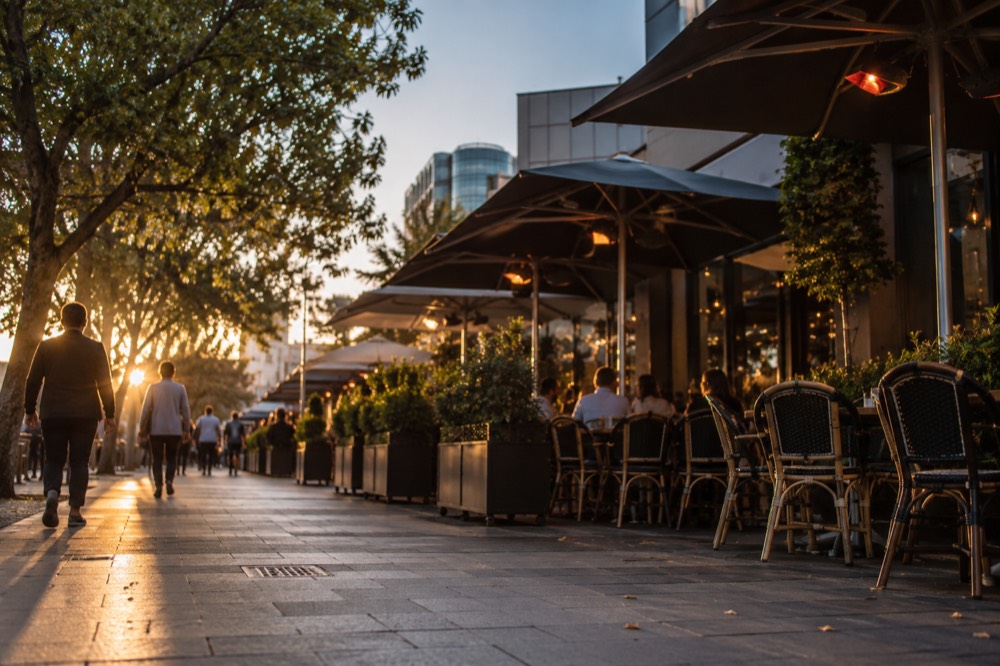 Church Street restaurant strip with outdoor tables and awnings in the evening