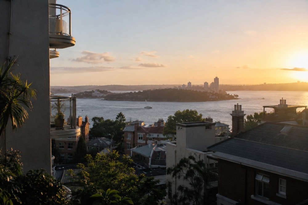 View over Potts Point rooftops toward Sydney Harbour and Garden Island
