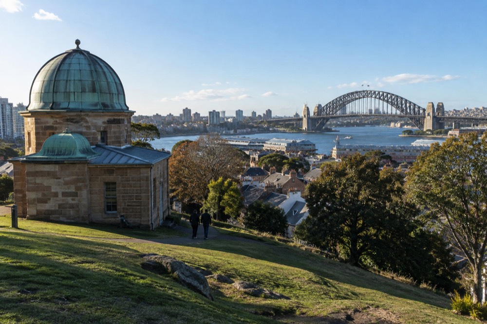 View from Observatory Hill park across rooftops toward the Sydney Harbour Bridge