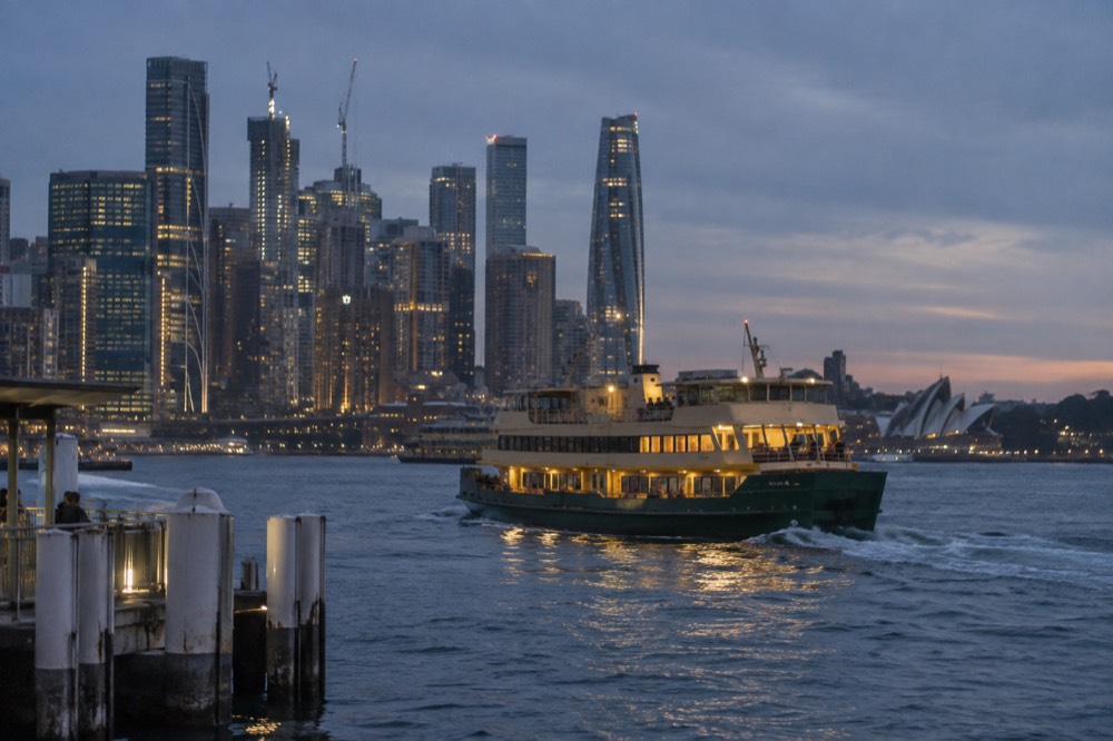 Ferry on Sydney Harbour with the city skyline behind it
