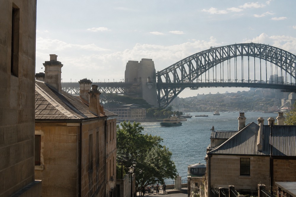 The south-east pylon of the bridge seen from The Rocks with sandstone buildings in the foreground