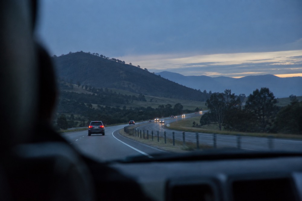 Highway running through green rolling hills of the Southern Highlands between Sydney and Canberra