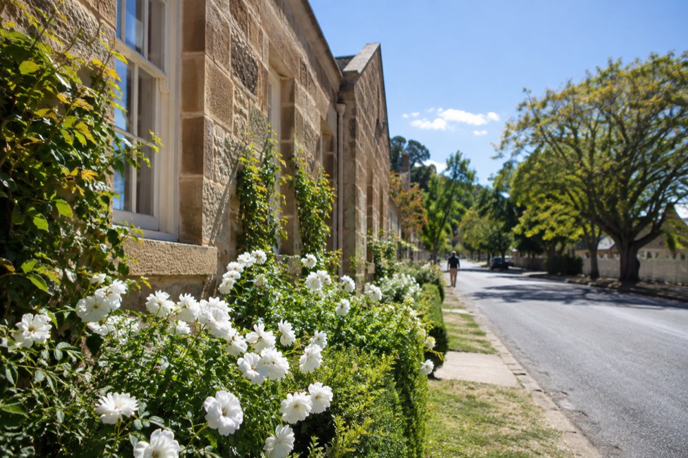 A heritage sandstone building on a quiet village street in Berrima
