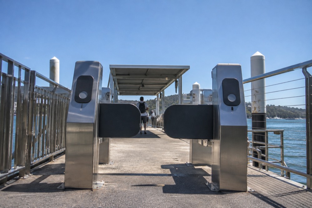 A ferry gangway gate with tap-on card readers at the entrance