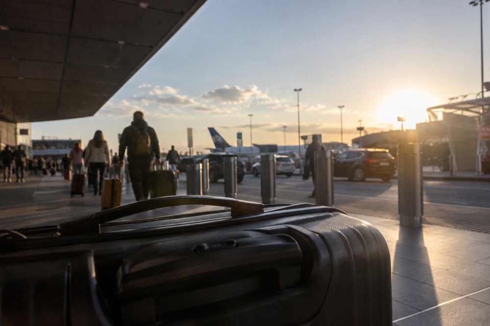 The international terminal forecourt at Sydney Airport with signage and departing traffic