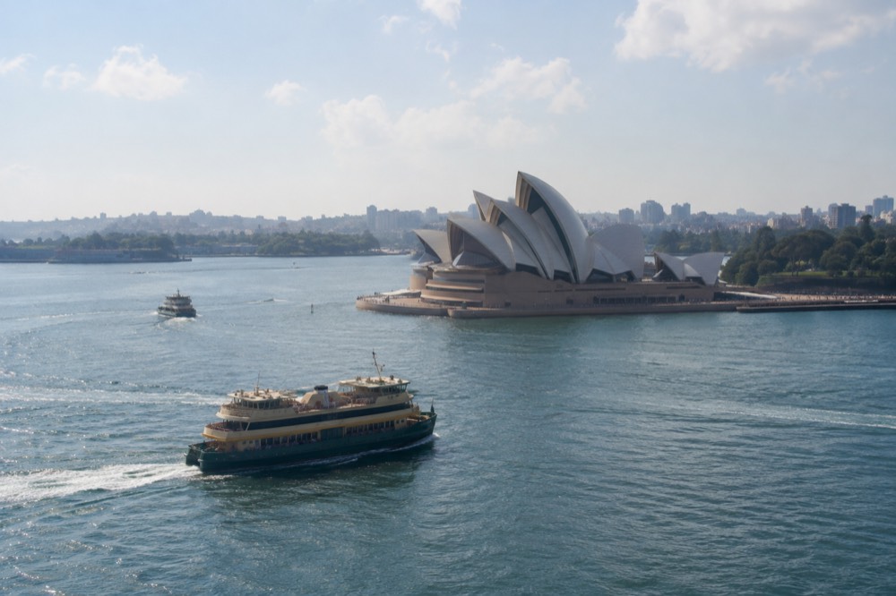 A ferry passing the Sydney Opera House sails on a bright afternoon