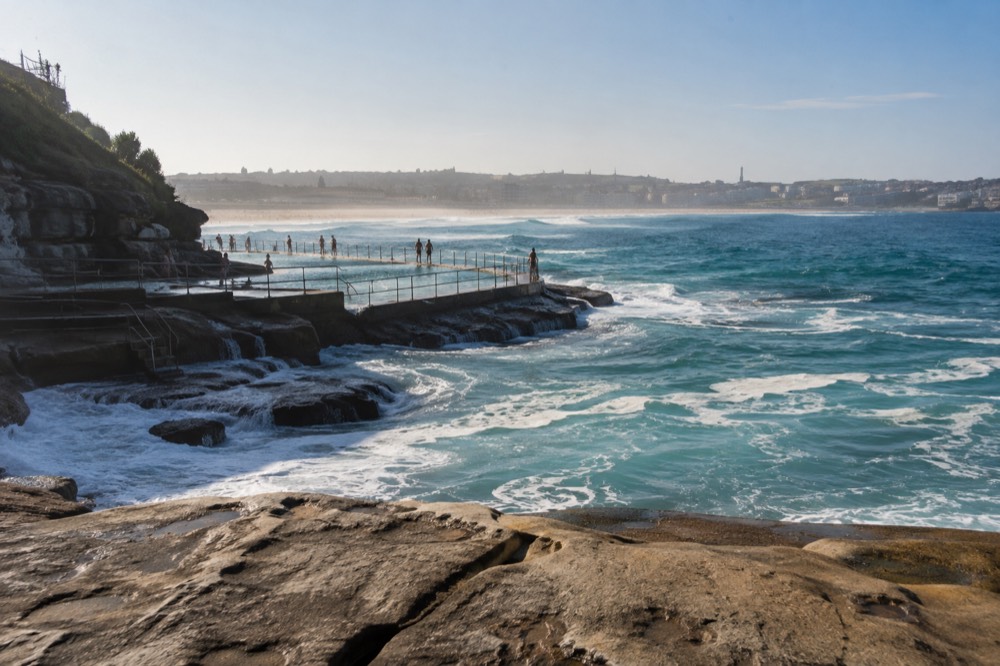 Ocean pool and sandstone cliffs along the Bondi to Coogee walk in morning light