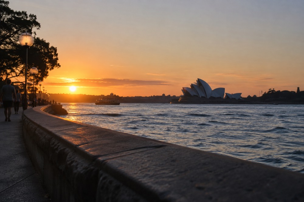 The Sydney Opera House northern boardwalk along the harbour at twilight