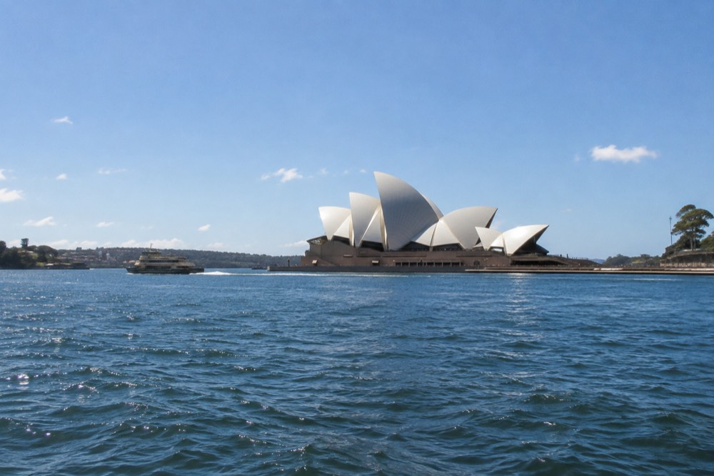 Sydney Opera House white sails beside Circular Quay on a clear day