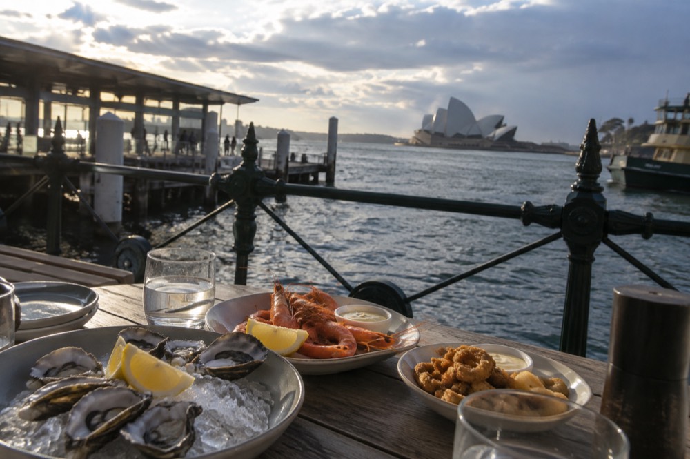 Plates of fresh seafood on a shared table