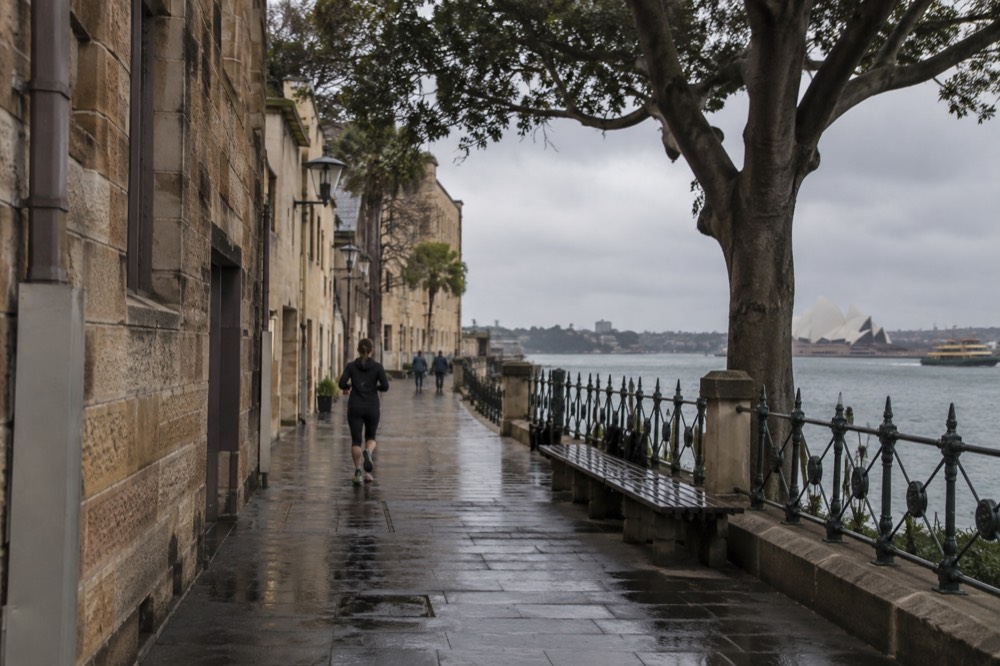 Sandstone buildings and a harbour foreshore path in The Rocks at morning