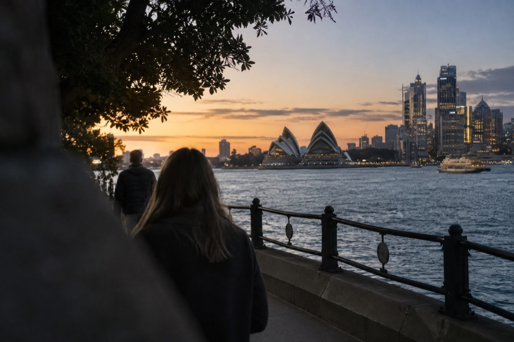 Harbour-side walking path at Kirribilli looking toward the city skyline and Opera House