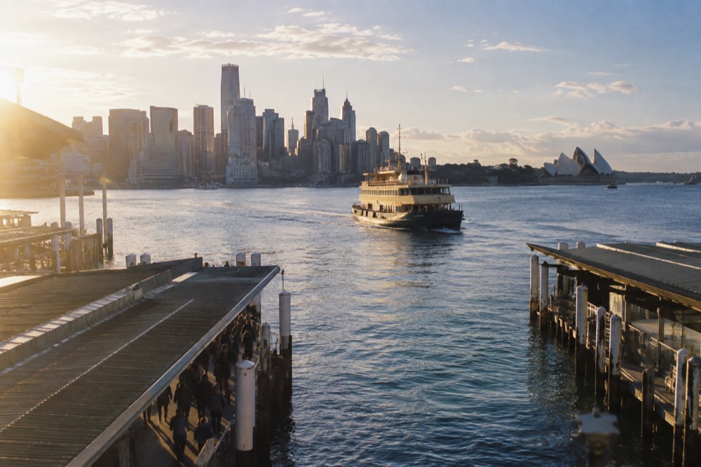 Ferry crossing Sydney Harbour toward Manly with the city skyline behind