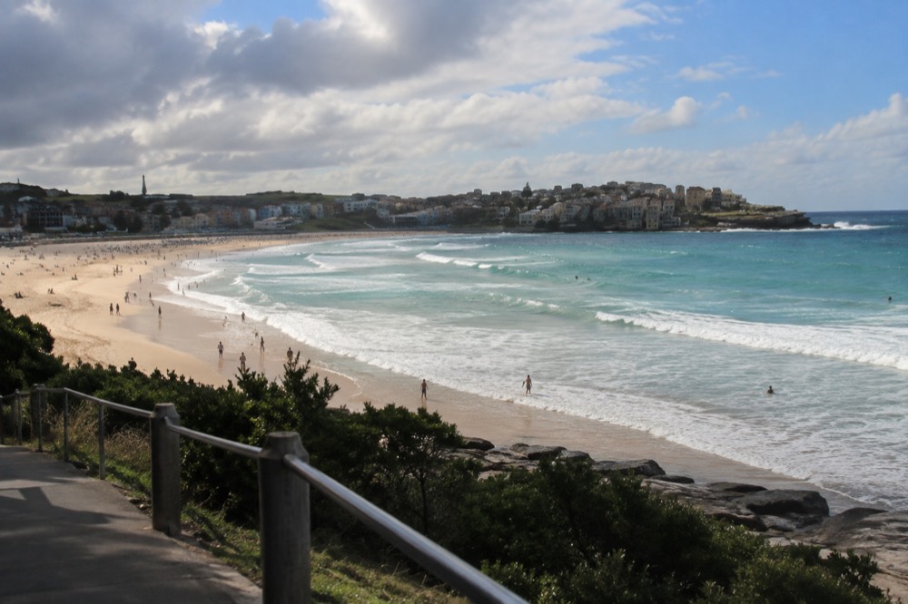 Bondi Beach curving towards the headland with surf at the southern end