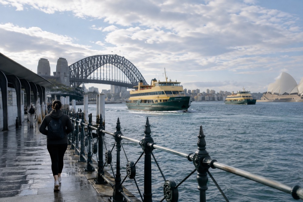 Ferries crossing Sydney Harbour with the Harbour Bridge in the background