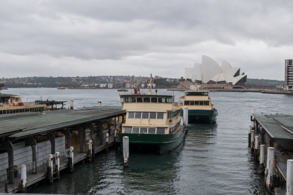 Ferries moored at Circular Quay with the Opera House in the background