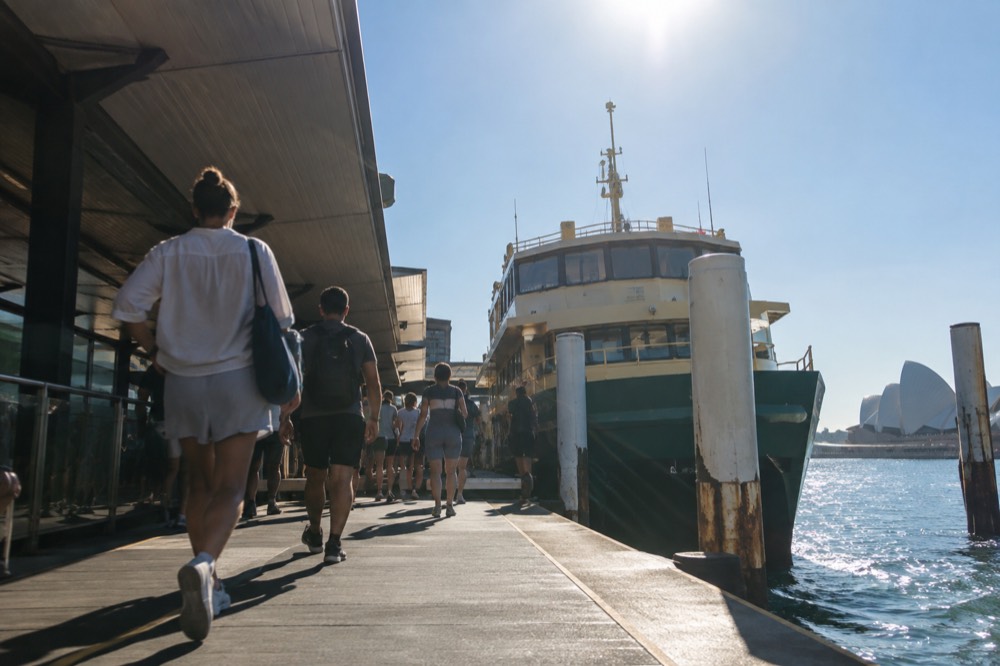 Ferry terminal at Circular Quay with commuters boarding in summer sunshine