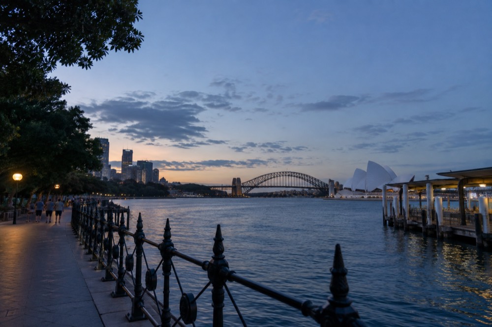 Crowd-free harbour foreshore parkland before an evening event