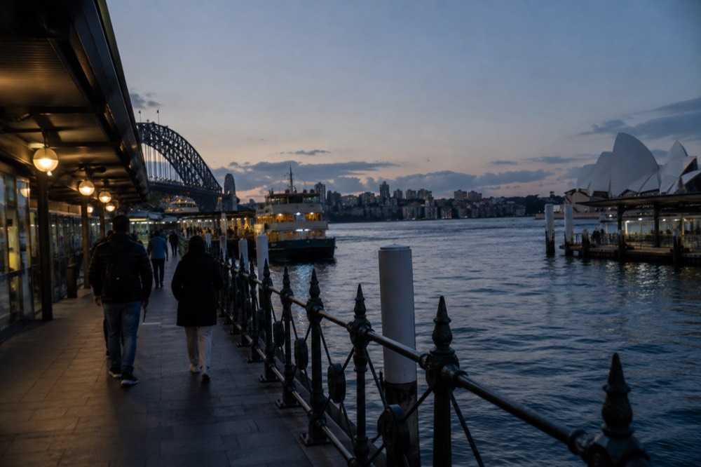 Visitors viewing exhibits inside a brightly lit museum gallery in Sydney